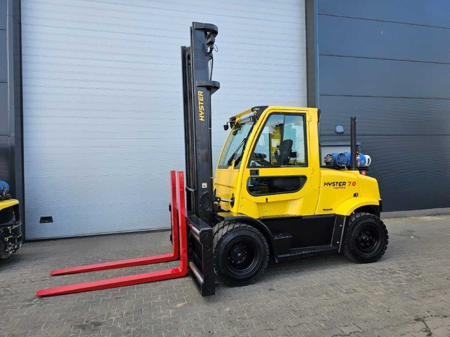 Použité vysokozdvižné vozíky HYSTER H7.0FT GAS VIERRADFRONTSTAPLER (12948574)