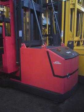 Wózki widłowe używane MAGAZINER EK1100 / Mastschwenkgabel ELEKTRO HOCHREGALKOMMISSIONIERER (2574043) backdrop